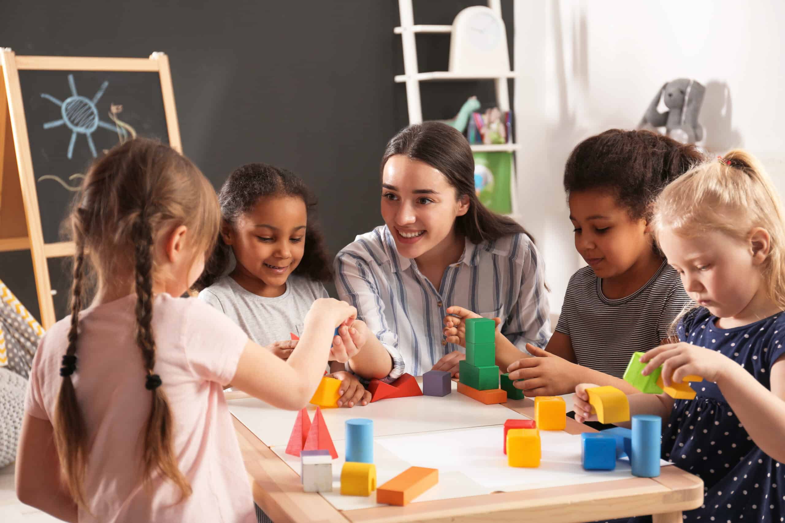 Children playing with colorful building blocks.