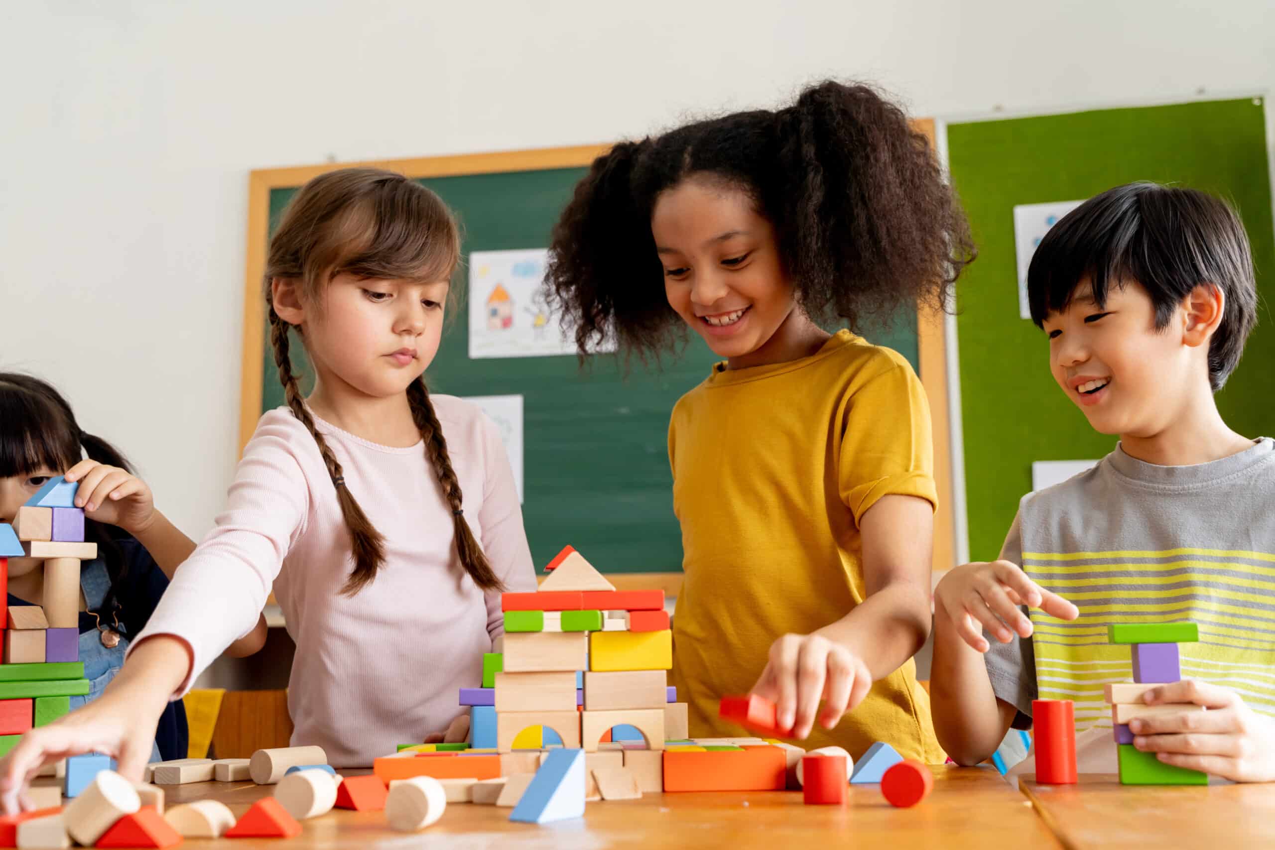 Children playing with colorful building blocks.